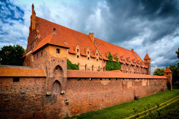 Vacations in Poland - Teutonic castle in Malbork Malbork, Poland - August 12, 2011:View of the middle Malbork Castle, Poland. The largest castle in the world by surface area, and the largest brick building in Europe. Historical capitol of the Teutonic Order - Crusaders malbork photos stock pictures, royalty-free photos & images