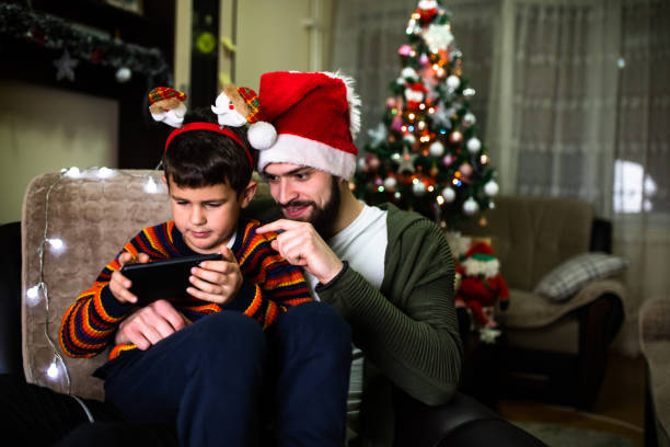 istock Brothers playing video games at Christmas 1293490955