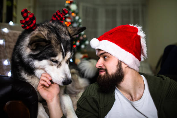 istock A young man and his dog at Christmas 1293490985