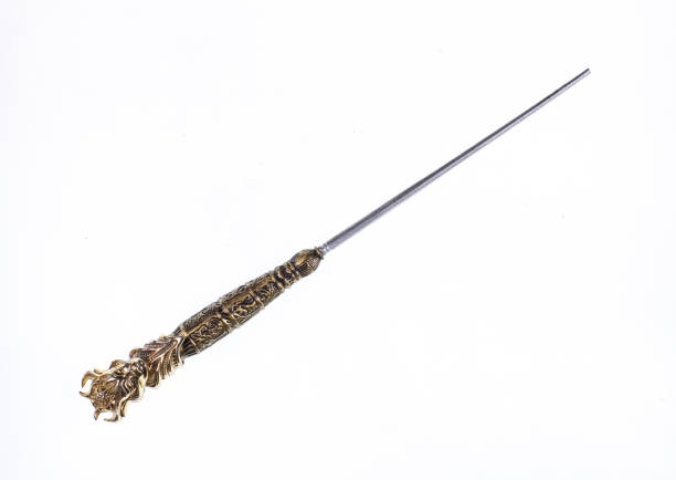 istock golden wizard wand isolated on white background 1293493980