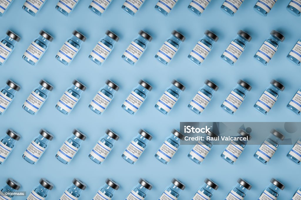 pattern of vaccine bottles against covid-19 with injection fluid. 3D ilustration pattern of vaccine bottles against covid-19 with injection fluid. Coronavirus vaccine. Blue background. 3D ilustration Vaccination Stock Photo
