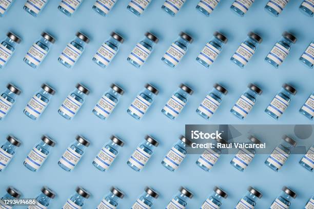 Pattern Of Vaccine Bottles Against Covid19 With Injection Fluid 3d Ilustration Stock Photo - Download Image Now