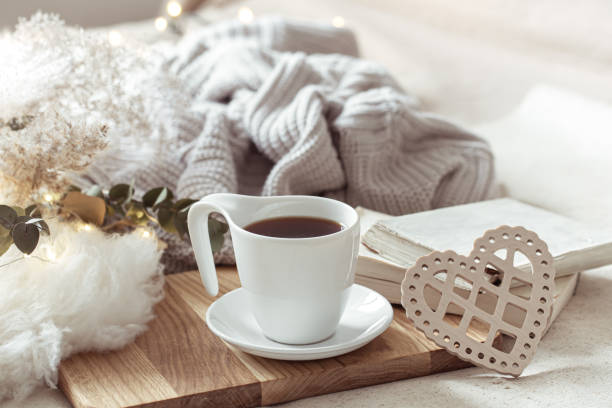 istock White cup with drink on blurred background home decor. 1293494748