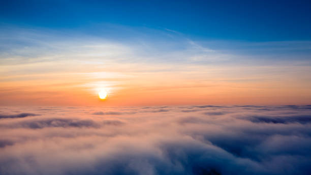istock Dawn or sunset over the clouds, blue hour, aerial view. 1293494803