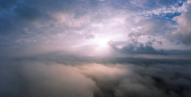 istock Dawn or sunset over the clouds, blue hour, aerial view. 1293494804