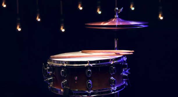 istock Snare drum and hi-hat in the dark on a blurred background with lights. 1293494932