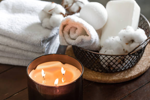 istock Spa composition with burning candles and bath accessories close up. 1293495594