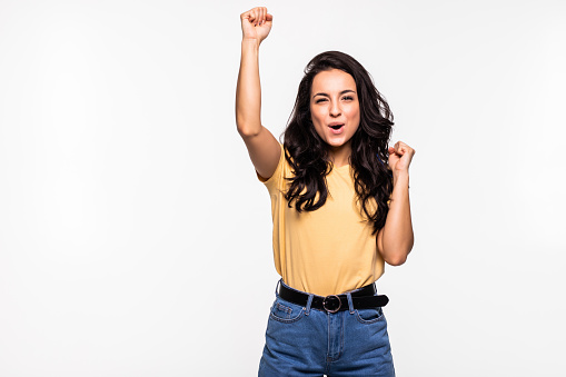 Beautiful woman raising her hands in gesture of happiness