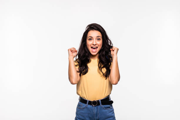 istock Successful woman looking very happy over a white backgorund 1293496624