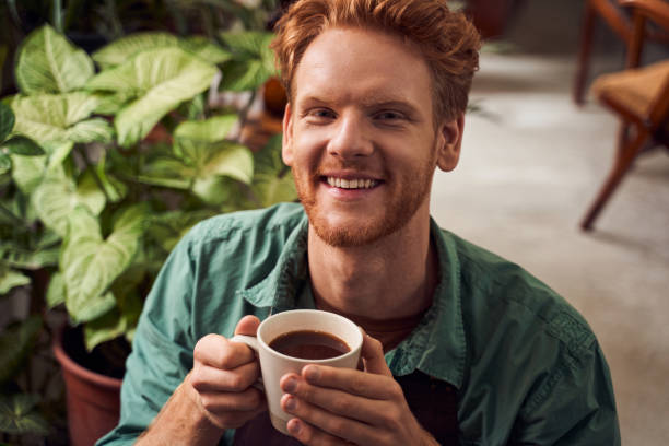 istock Red head florist enjoying hot coffee 1293496770