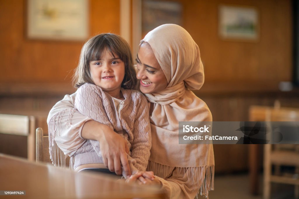 Muslim mother and daughter An adorable pair of a muslim mother and daughter together. Refugee Stock Photo