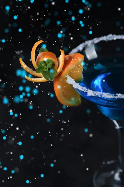 Art in orange- fruits carving. How to make to citrus garnish design for a drink. Cocktail Blue lagoon