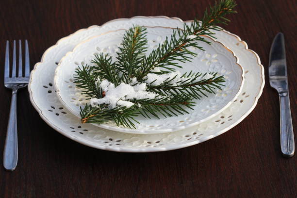 istock Festive Christmas table setting, table decoration with fir branches, woodene background 1293500116