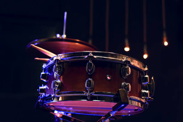 istock Snare drum and drumsticks close up in dark. 1293501007