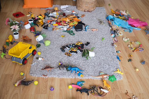 A Child room is so messy and full of toys.