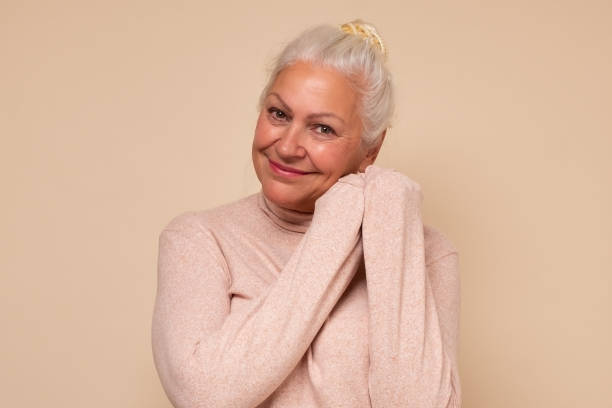 istock Attractive old caucasian woman, pretty smiling face. 1293503973