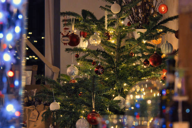 istock a Christmas tree decorated with balls and lights 1293504757