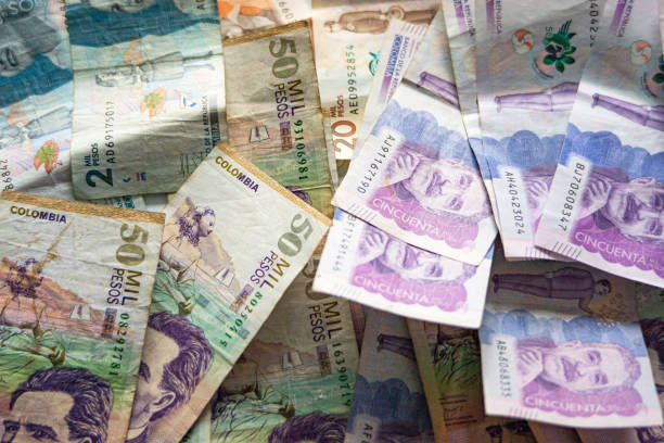 Colombian banknotes A lot of colombian baknotes of different denominations like $50.000, $20.000 and $2.000 colombian peso stock pictures, royalty-free photos & images