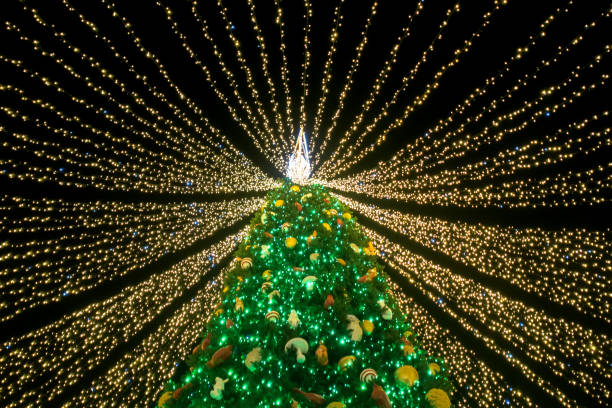istock Christmas tree covered with garlands ribbons 1293505080