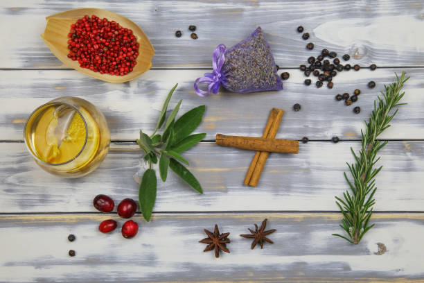 Top down view on white timber plank table with gin tonic glass, red pepper, lavender, rosemary, sage, cranberries, anise botanicals Top down view on white timber plank table with gin tonic glass, red pepper, lavender, rosemary, sage, cranberries, anise botanicals. Germany vodka soda top view stock pictures, royalty-free photos & images