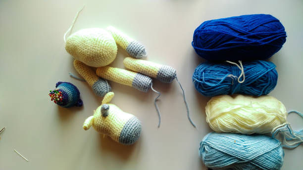 istock process and materials for crocheting handmade unicorn toy 1293508759