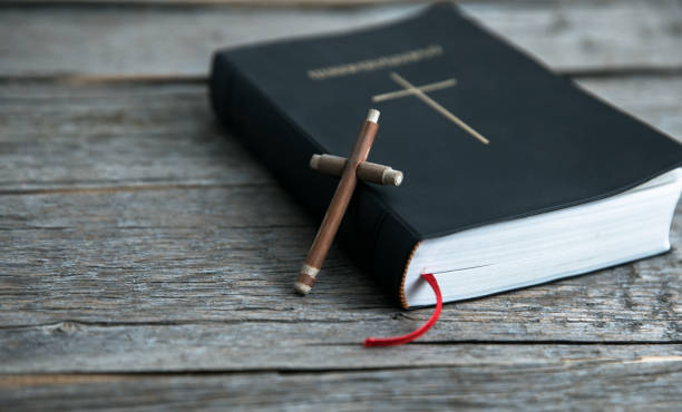 istock wooden cross and Bible 1293511836