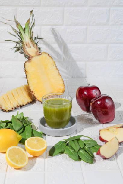 istock Healthy green smoothie juice with spinach lemon and pineapple 1293511907