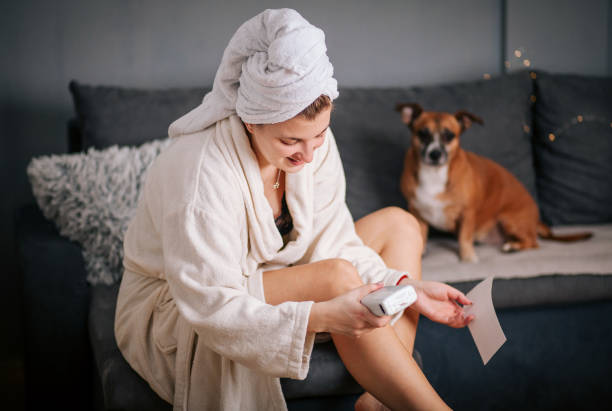 Woman Waxing Legs at Home