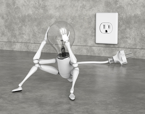 A light bulb character is sitting sadly on the floor holding his bulb with the hands because his plug isn't the right one for the socket on the wall and he can't plug it in, on a grey abstract background
