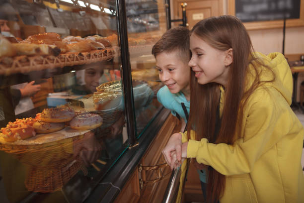 istock Lovely twins shopping at bakery 1293516453