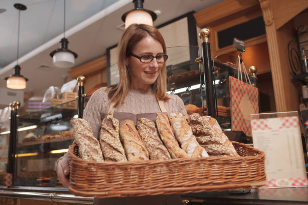 istock Mature woman working at her bakery 1293517169