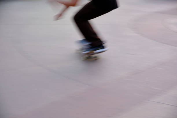 istock Skateboarders Practice at Skate Park -- Motion Blur 1293518982