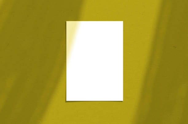 istock Blank white vertical paper sheet 5x7 inches with shadow overlay. Illuminating Pantone Color Of The Year 2021. Modern and stylish greeting card or wedding invitation mock up. 1293519829