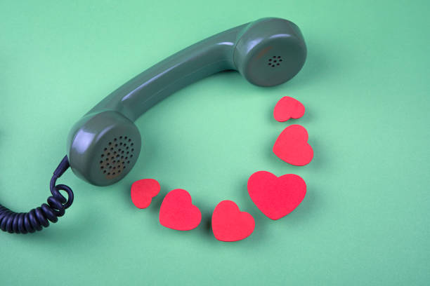 istock Old rotary telephone handset and red hearts 1293521448