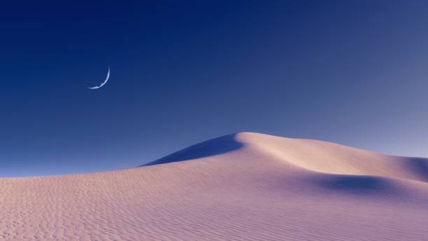 夜空の砂漠の風景と半月