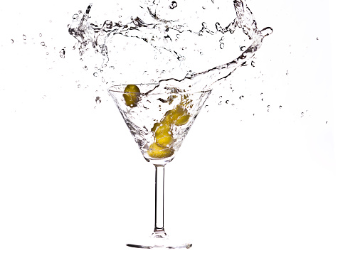 Olives in a martini Splash on white background