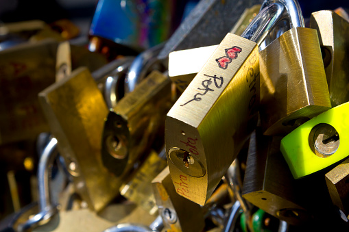 Closed locks on a bridge symbolizing the love