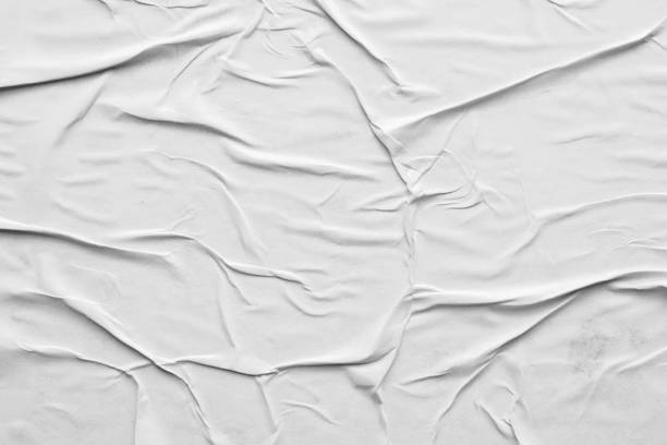 istock Blank white crumpled and creased paper poster texture background 1293527356
