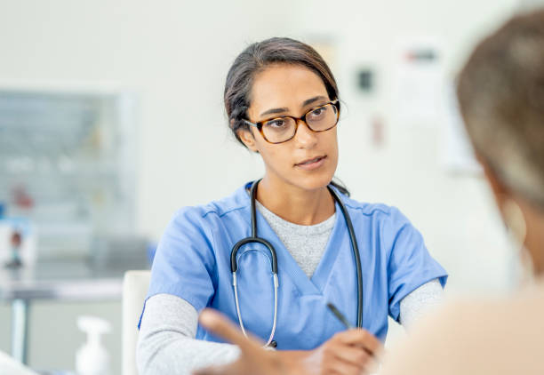 istock Middle Eastern nurse talking to patient 1293527436