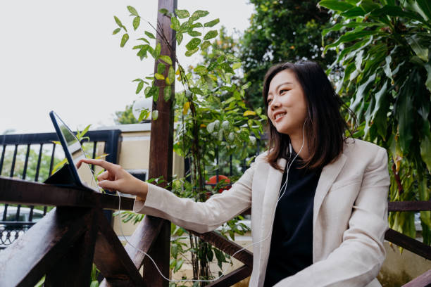 istock Young asian woman using digital tablet for work at home 1293529269