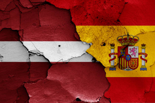 istock flags of Latvia and Spain painted on cracked wall 1293532338