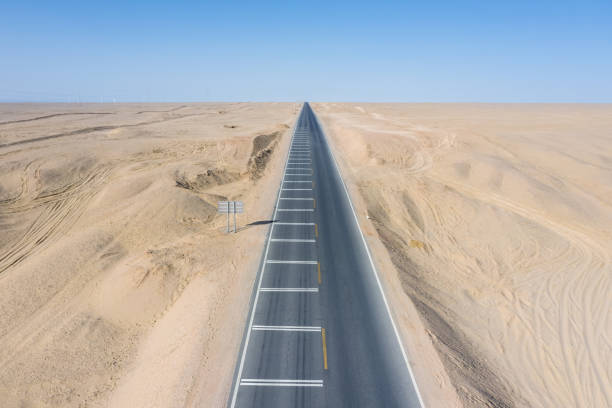 istock aerial view road on desert 1293535673