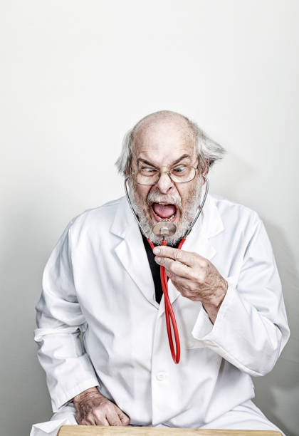 istock Bizarre Distressed Scientist Doctor Professor Screaming Into Stethoscope 1293536980