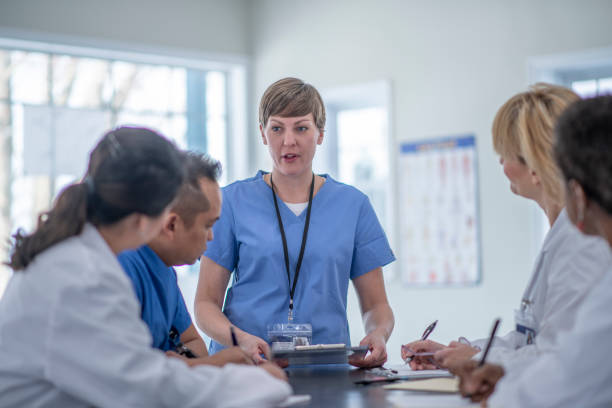 istock Multi ethnic group of doctors meeting 1293539955