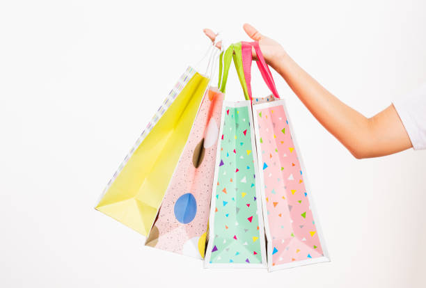 istock women hand holding colorful multicolor shopping bag many packets 1293540575