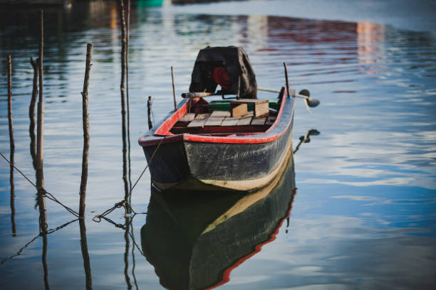 istock old wooden boat floating over plain water 1293543719