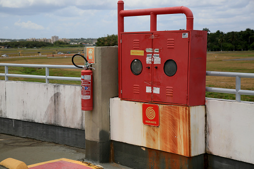 salvador, bahia, brazil - december 23, 2020: hisdrante area and fire extinguisher is seen in the parking area of the airport of the city of Salvador.