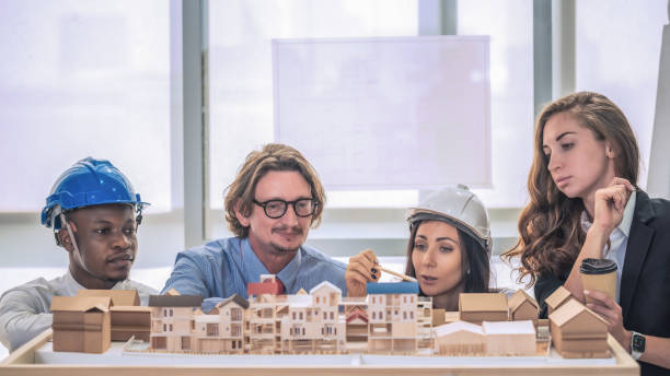 istock architecture business background of diverse project development architect team have brainstorming for residential project work with project architecture model on table in architecture office 1293544325