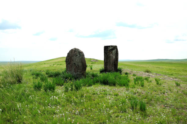 Ancient sacral stones at the entrance to the endless steppe. Gateway to the Valley of the Kings, Khakassia, South Siberia, Russia.