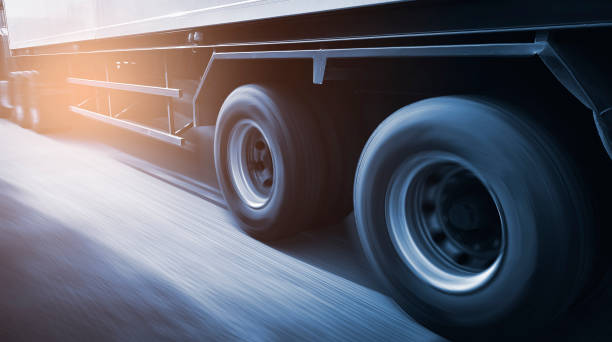 a motion blurred image of a moving semi-truck